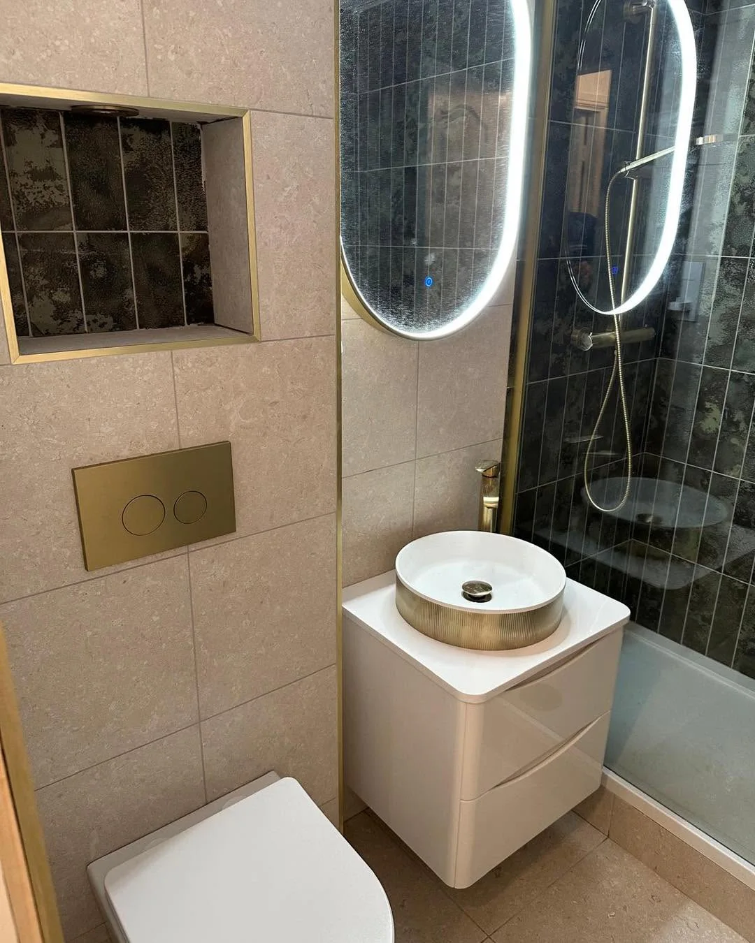 Finished stone and bronze shower room
